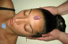 Healing crystals on the head and neck